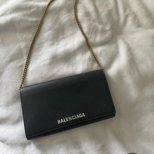 Crossbody balenciaga wallet on a chain, gold hardware.